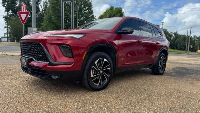 2026 Buick Enclave Sport Touring in Cherry Red Tintcoat — front three-quarter view